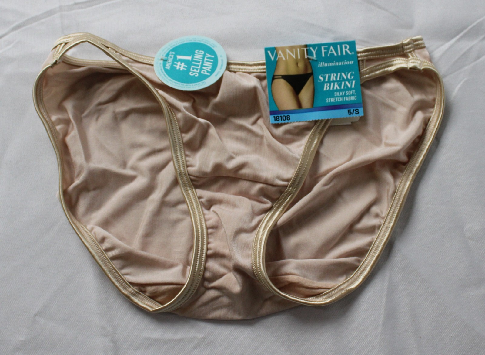 Vanity Fair Women’s Illumination String Bikini Panties AC2 Beige Size: 5 (Small)