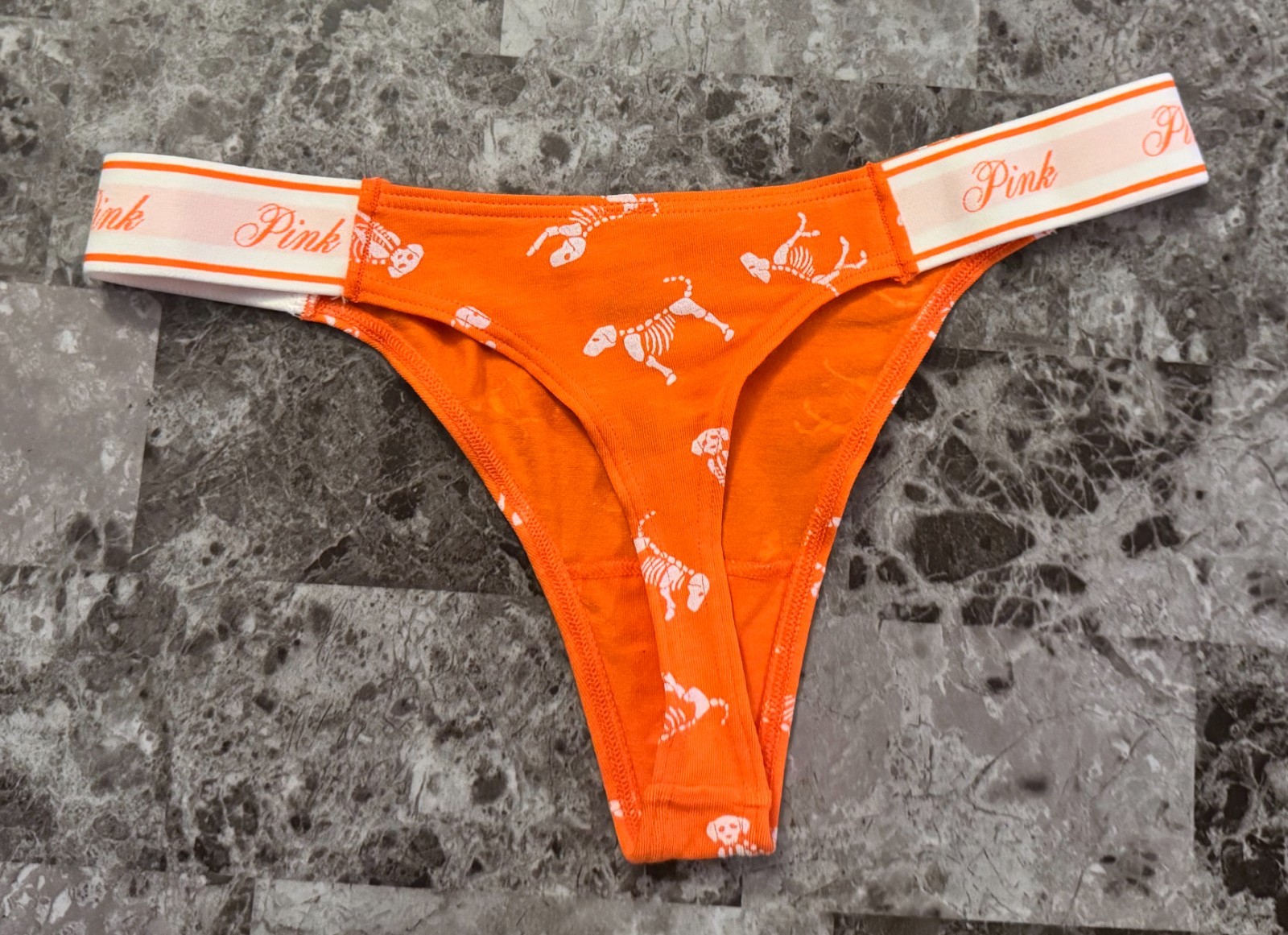 NWT VICTORIA’S SECRET PINK ORANGE WHITE SKELETON DOG HALLOWEEN THONG PANTIES